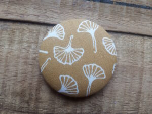 Big textile covered button brooch available for purchase