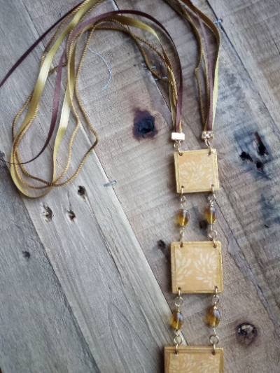 Boho style wood & textile necklace available for purchase